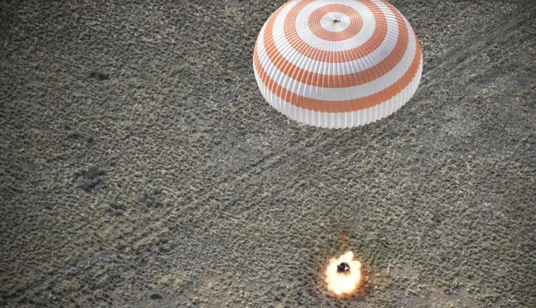 Russian, North American astronauts back to earth