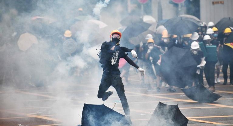 Police fire tear gas near liaison office in Hong Kong