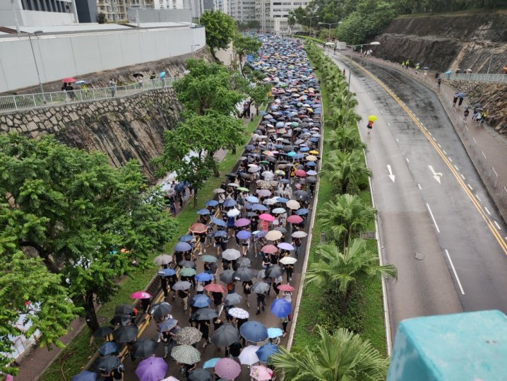 Thousands rally in Hong Kong under stormy skies