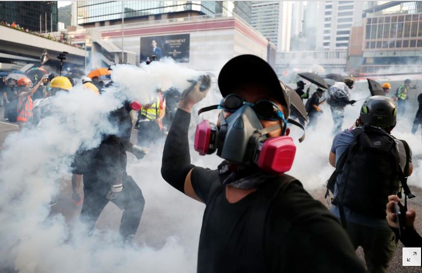 Hong Kong police fire tear gas, water cannon at protesters