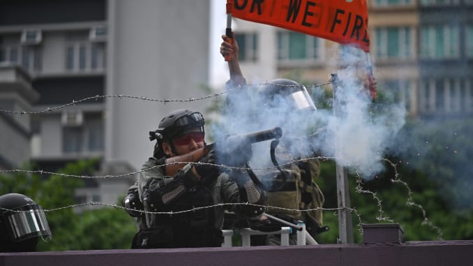 Chinese soldiers in Hong Kong warn protesters