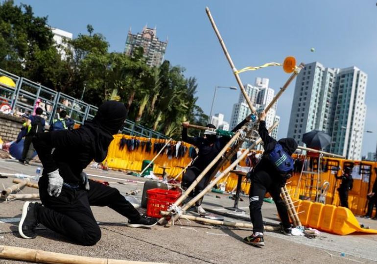 Schools in Hong Kong close as protesters occupy roads, campuses