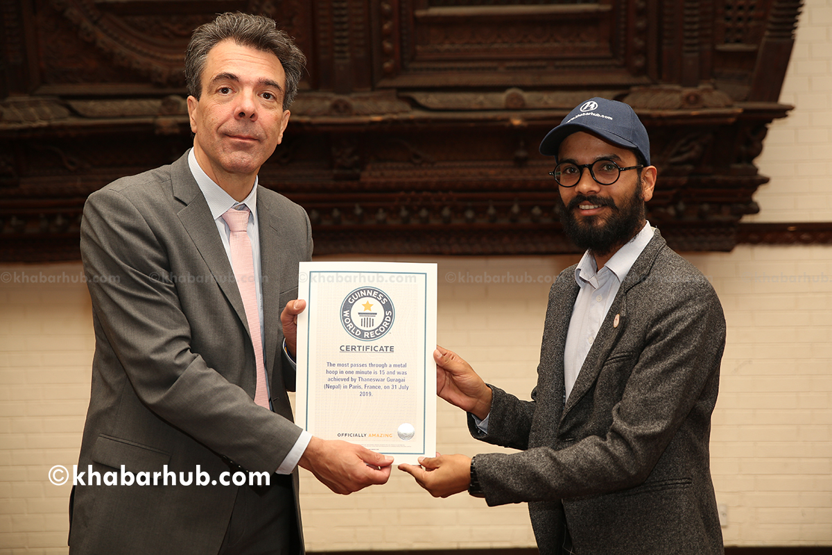 Guinness World Record certificates handed to Khabarhub Special Correspondent Thaneswar
