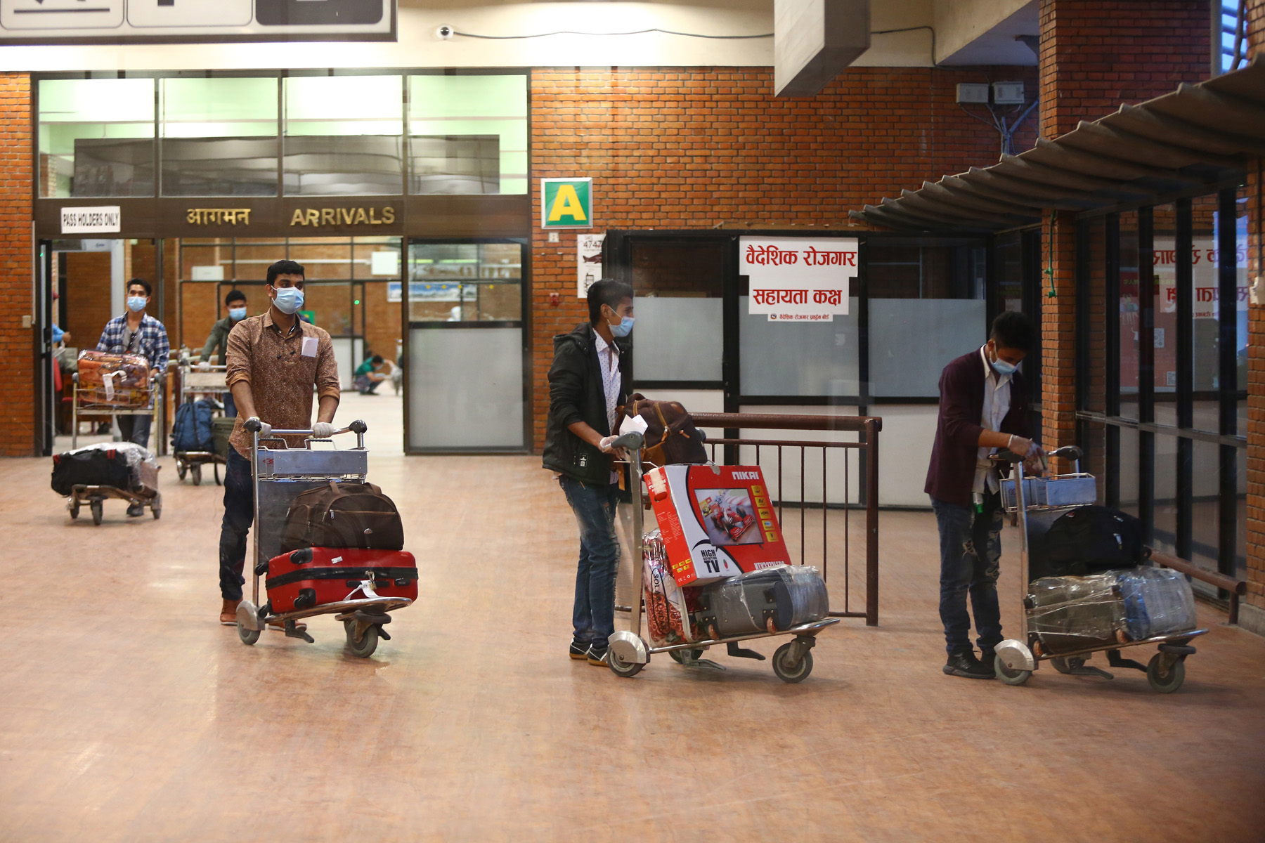 294 Nepalis return home from Qatar