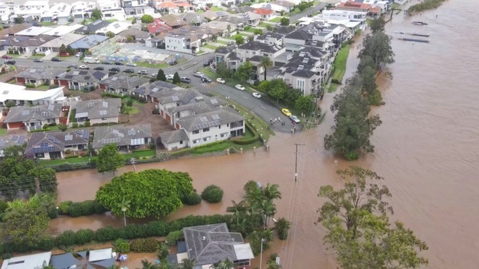 Thousands evacuated as downpours trigger Australia floods