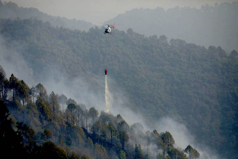 Simrik Air chopper on a fire-fighting mission