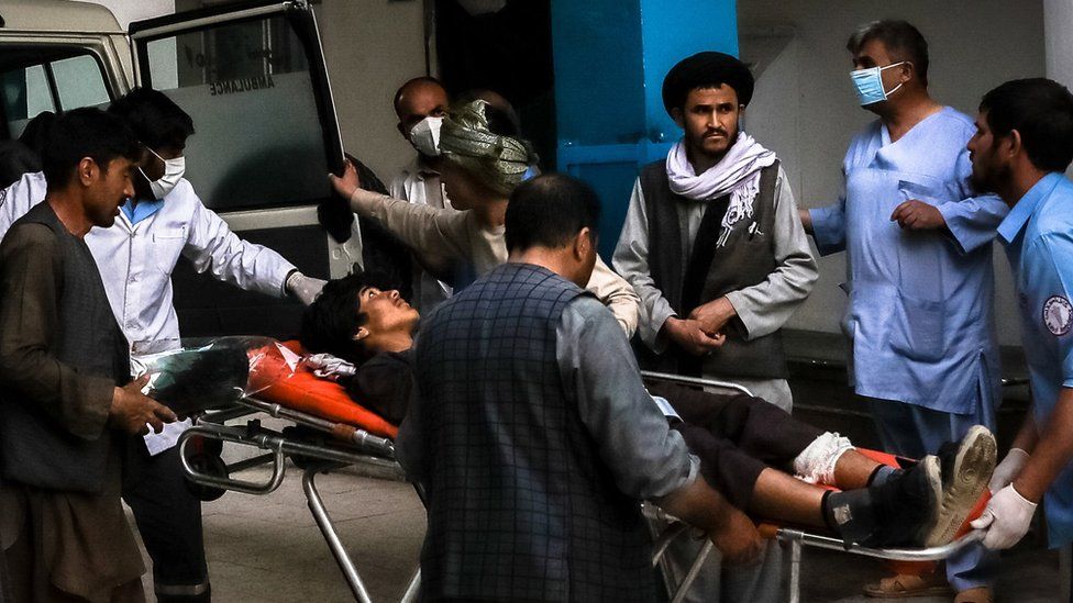 Blasts near a school leave at least 30 dead in Kabul