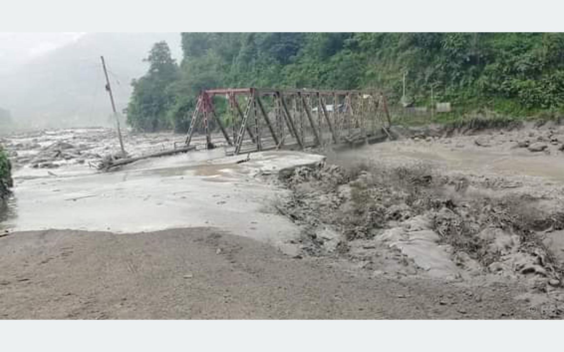 People’s mobility halts after flood sweeps away bridge