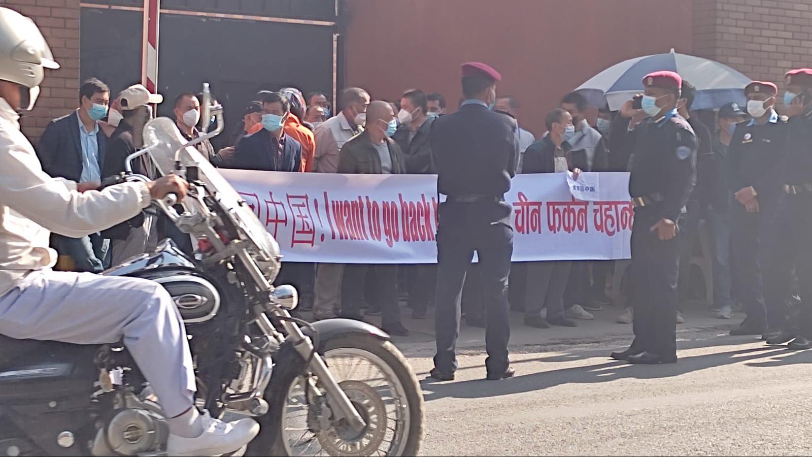 Chinese nationals protest outside China’s Consular Section in Kathmandu seeking prompt return home