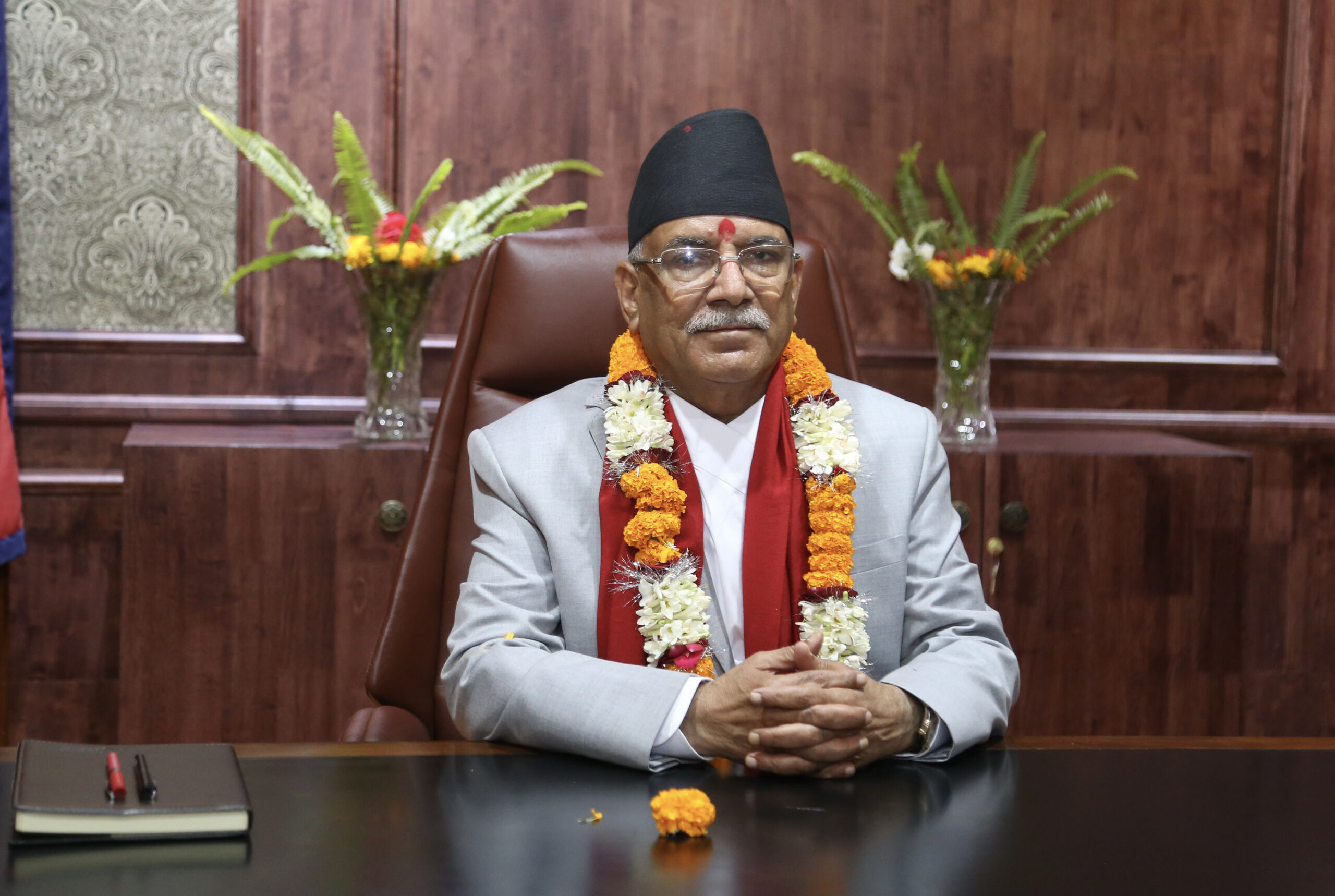 Let returnees bring two mobile phones from abroad: PM Dahal